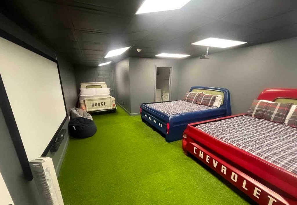 Indoor truck bed themed movie theater and bedroom at Go-karts racing Airbnb.