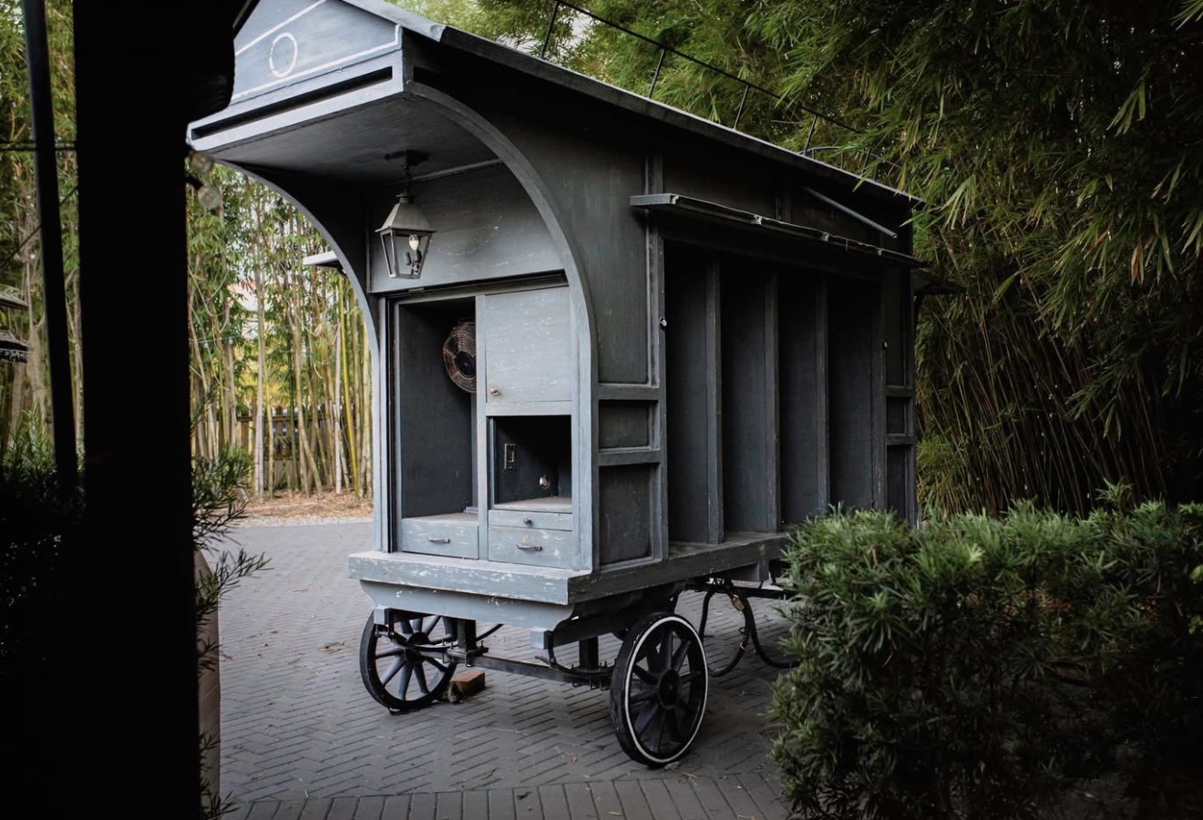 Rear and side view of the Harry Potter wagon for sale, showing its lantern, cabinets and spoked wheels